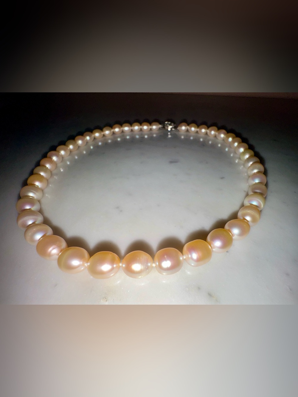 Lustrous Single Strand Semi-Baroque Pink/Peach Choker Length Cultured Pearls